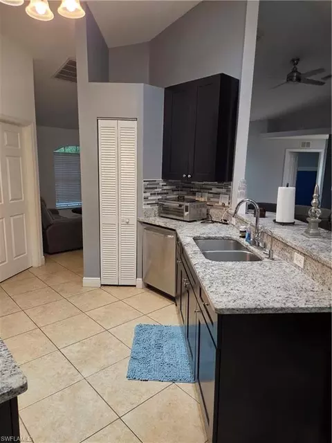 Kitchen - 1025 Iris St E, Lehigh Acres, FL 33974 photo 2 of 4
