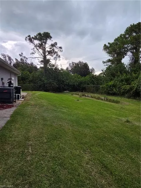 Exterior - 1025 Iris St E, Lehigh Acres, FL 33974 photo 10 of 13
