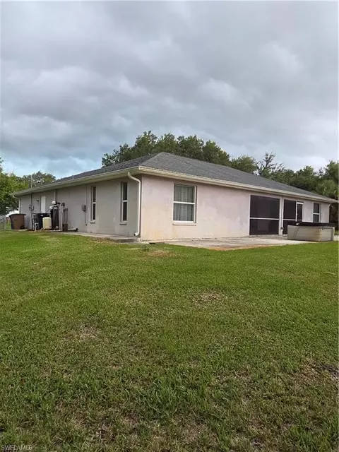 Exterior - 1025 Iris St E, Lehigh Acres, FL 33974 photo 8 of 13