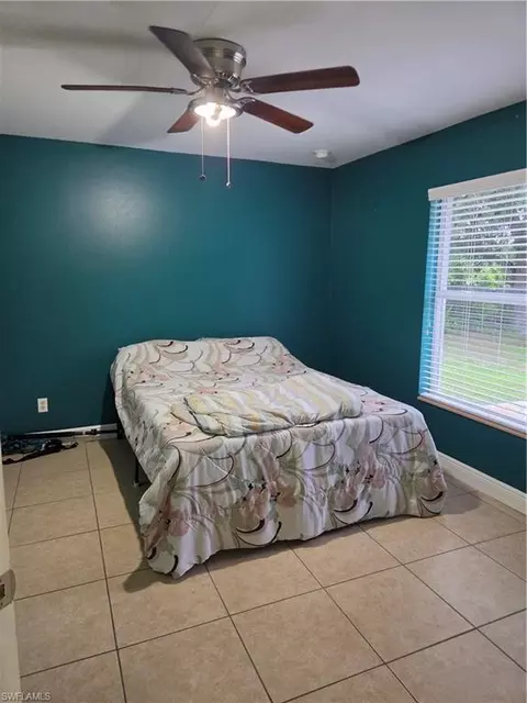 Bedroom - 1025 Iris St E, Lehigh Acres, FL 33974 photo 1 of 2
