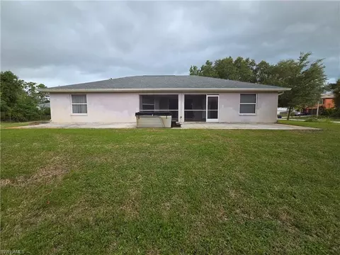 Exterior - 1025 Iris St E, Lehigh Acres, FL 33974 photo 4 of 13