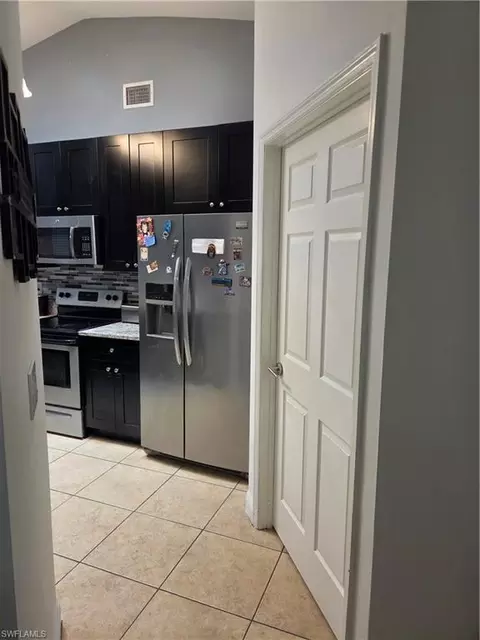Entry Way - 1025 Iris St E, Lehigh Acres, FL 33974 photo 3 of 5