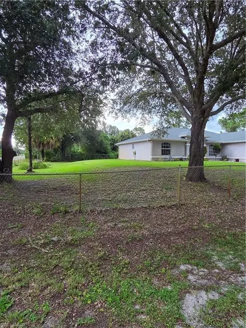 Exterior - 1025 Iris St E, Lehigh Acres, FL 33974 photo 5 of 13