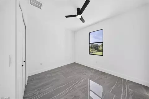 Bedroom - 2621 40th St W, Lehigh Acres, FL 33971 photo 4 of 6