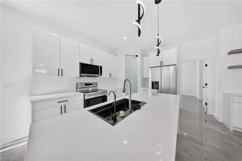 Kitchen - 2621 40th St W, Lehigh Acres, FL 33971 photo 2 of 6
