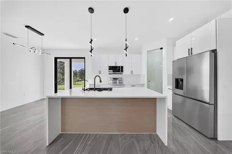 Kitchen - 2621 40th St W, Lehigh Acres, FL 33971 photo 3 of 6
