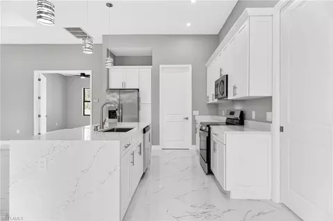 Kitchen - 1114 Bari St E, Lehigh Acres, FL 33974 photo 5 of 6