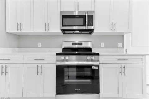 Kitchen - 1114 Bari St E, Lehigh Acres, FL 33974 photo 3 of 6