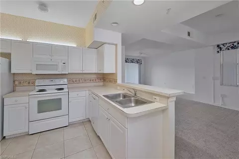 Kitchen - 331 Dover Pl #G-103, Naples, FL 34104 photo 3 of 4