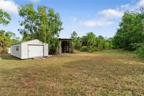 Exterior - 690 14th St SE, Naples, FL 34117 photo 6 of 10