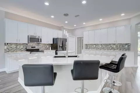 Kitchen - 5655 Cedar Tree Ln, Naples, FL 34116 photo 1 of 2