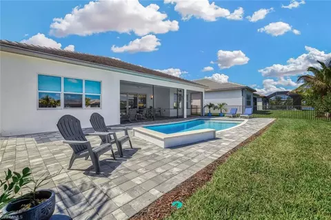 Exterior - 11679 Periwinkle Dr, Naples, FL 34120 photo 6 of 12