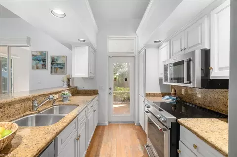 Kitchen - 4868 W Boulevard Ct, Naples, FL 34103 photo 3 of 5