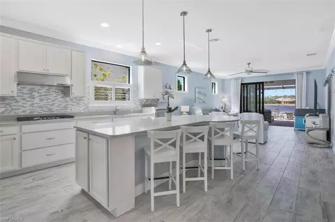 7454 Winding Cypress Dr, Naples, FL 34114