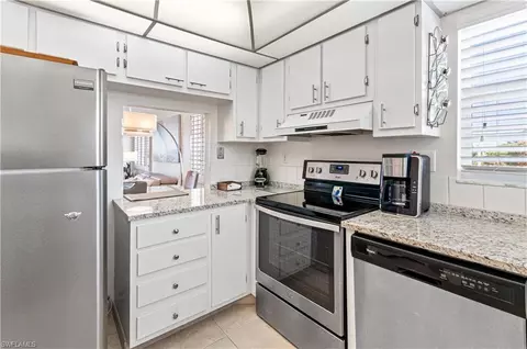 Kitchen - 21 High Point Cir E #410, Naples, FL 34103 photo 2 of 2
