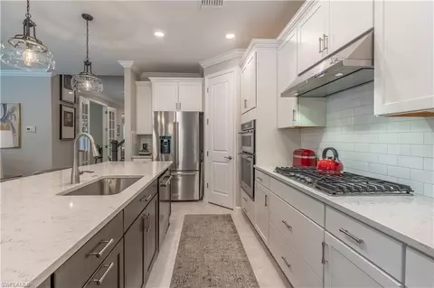Kitchen - 7493 Winding Cypress Dr, Naples, FL 34114 photo 3 of 5