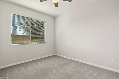 Bedroom - 10140 Tin Maple Dr #21, Estero, FL 33928 photo 6 of 7