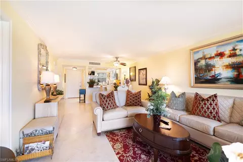 Living - 37 High Point Cir E #107, Naples, FL 34103 photo 1 of 2
