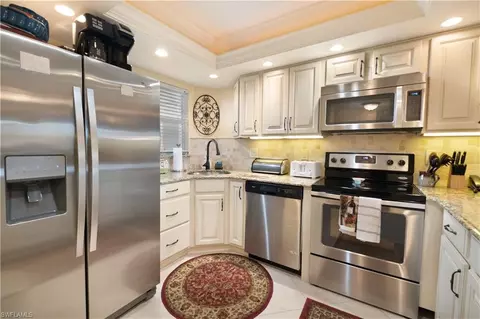 Kitchen - 37 High Point Cir E #107, Naples, FL 34103 photo 2 of 3
