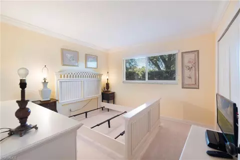 Bedroom - 37 High Point Cir E #107, Naples, FL 34103 photo 2 of 2