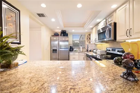 Kitchen - 37 High Point Cir E #107, Naples, FL 34103 photo 3 of 3