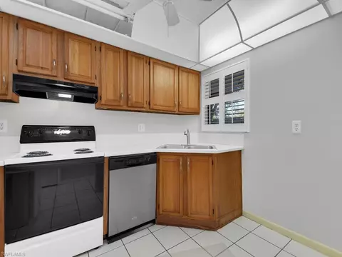 Kitchen - 37 High Point Cir E #106, Naples, FL 34103 photo 2 of 2