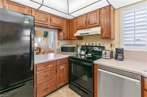 Kitchen - 29 High Point Cir E #508, Naples, FL 34103 photo 2 of 2