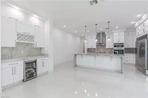 Kitchen - 3074 Pine Tree Dr, Naples, FL 34112 photo 3 of 4