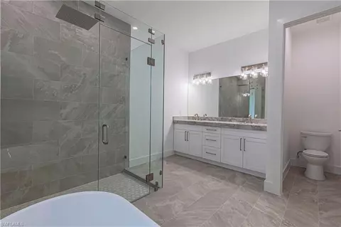 Bath - 3074 Pine Tree Dr, Naples, FL 34112 photo 2 of 5