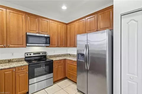 Kitchen - 7029 Ambrosia Ln #606, Naples, FL 34119 photo 2 of 3