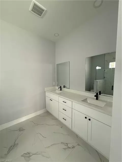 Bath - 1104 Garibaldi St E, Lehigh Acres, FL 33974 photo 2 of 3