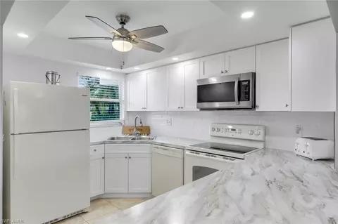 Kitchen - 37 High Point Cir E #109, Naples, FL 34103 photo 2 of 4
