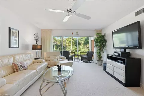 Living - 215 Cypress Way E #D8, Naples, FL 34110 photo 1 of 3