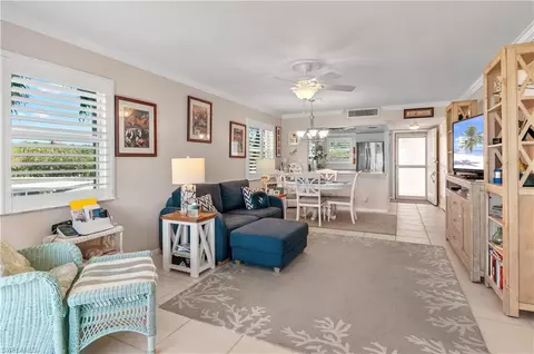Living - 37 High Point Cir E #210, Naples, FL 34103 photo 1 of 4