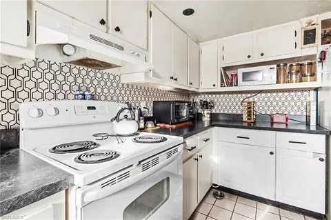 Kitchen - 180 Cypress Way E #A103, Naples, FL 34110 photo 5 of 6