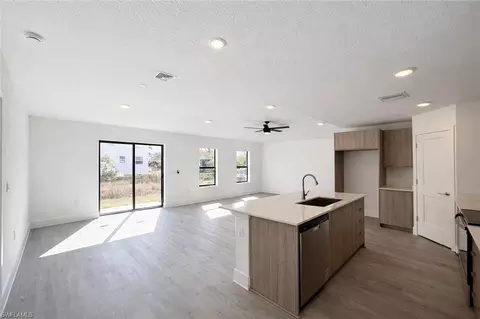Living - 1608 Gene Ave S, Lehigh Acres, FL 33976 photo 2 of 3