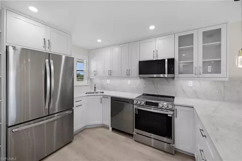 Kitchen - 21 High Point Cir E #409, Naples, FL 34103 photo 5 of 6