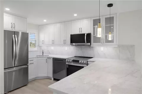 Kitchen - 21 High Point Cir E #409, Naples, FL 34103 photo 4 of 6