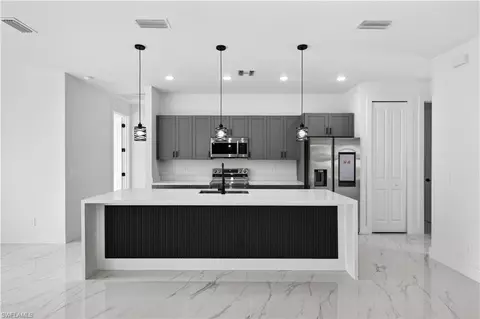 Kitchen - 1402 E 7th St, Lehigh Acres, FL 33972 photo 1 of 3