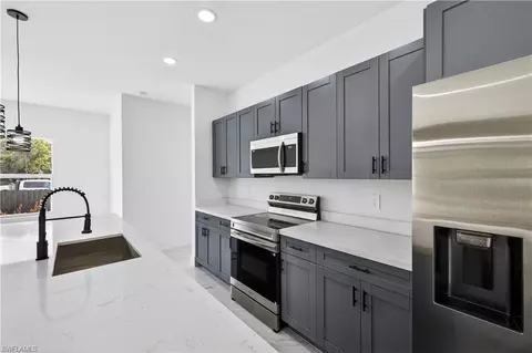 Kitchen - 1402 E 7th St, Lehigh Acres, FL 33972 photo 3 of 3