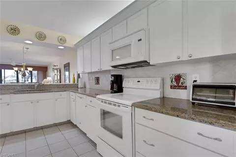 Kitchen - 4310 Chantelle Dr #E102, Naples, FL 34112 photo 2 of 3
