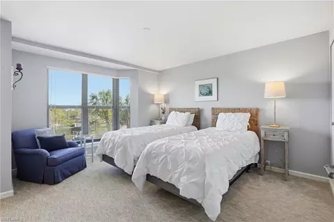 Bedroom - 309 La Peninsula Blvd #309, Naples, FL 34113 photo 5 of 6