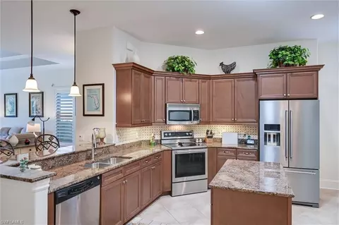 Kitchen - 7587 Moorgate Point Way, Naples, FL 34113 photo 5 of 9