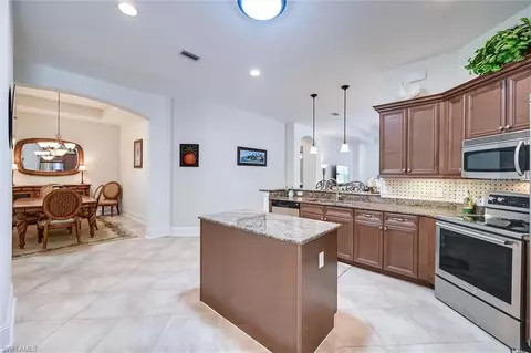 Kitchen - 7587 Moorgate Point Way, Naples, FL 34113 photo 9 of 9