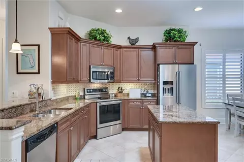Kitchen - 7587 Moorgate Point Way, Naples, FL 34113 photo 7 of 9