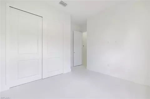 Bedroom - 1211 Cloplon St E, Lehigh Acres, FL 33974 photo 7 of 8