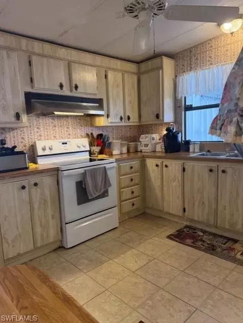 Kitchen - 210 Pine Key Ln #210, Naples, FL 34114 photo 2 of 3