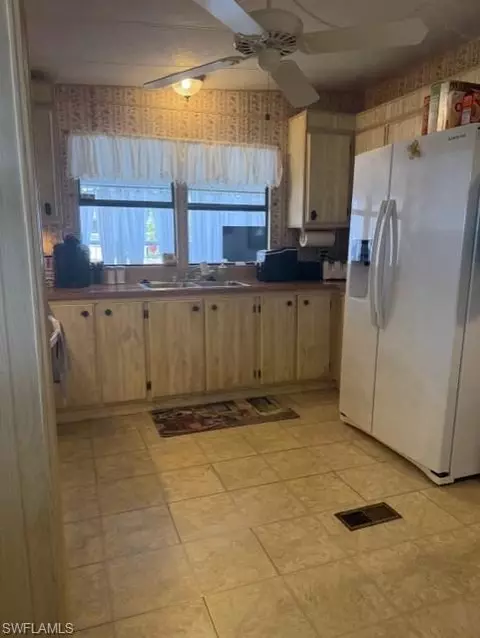 Kitchen - 210 Pine Key Ln #210, Naples, FL 34114 photo 3 of 3