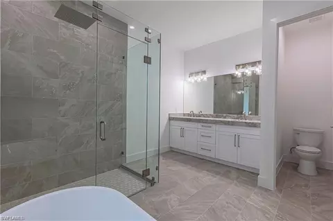 Bath - 3098 Pine Tree Dr, Naples, FL 34112 photo 2 of 5