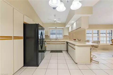 Kitchen - 704 106th Ave N, Naples, FL 34108 photo 1 of 2